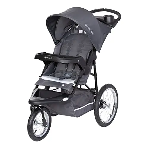 Baby Trend Expedition Jogger stroller on grassy terrain